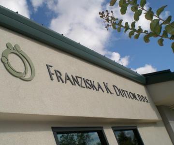 Dimensional logo and letters on wall