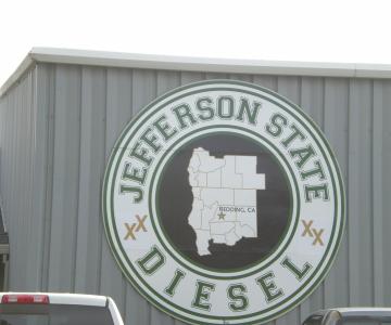 Custom shaped multi-panel MDO sign panel with combination of paint and vinyls