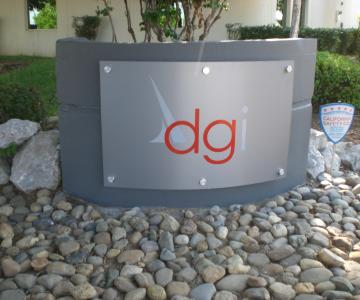 Brushed aluminum panel custom curved for monument with sign vinyl decoration and aluminum standoffs for mounting to concrete.